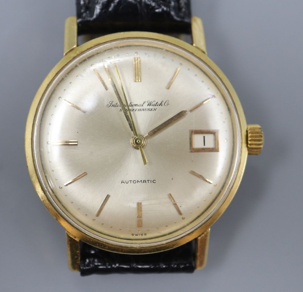 A gentlemans 18ct gold International Watch Co automatic wrist watch, with baton numerals, centre seconds and date aperture, diameter 3